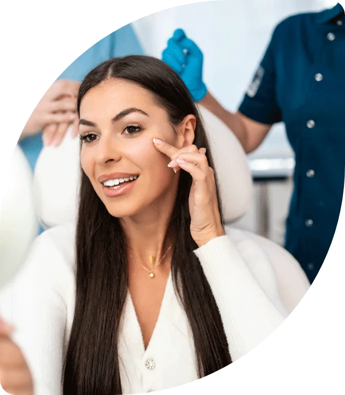 Woman smiles and looks at her Botox injection